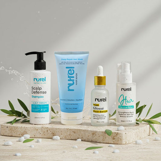 Set of Rurel hair care products on a wooden surface with a neutral background