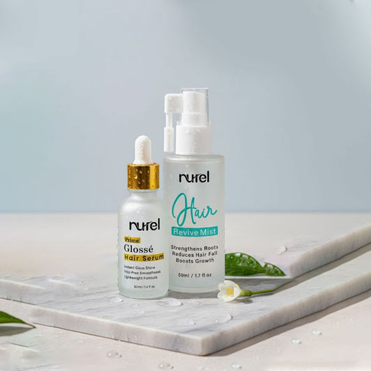Two hair care products from the brand 'nurel' on a marble surface with a light blue background.