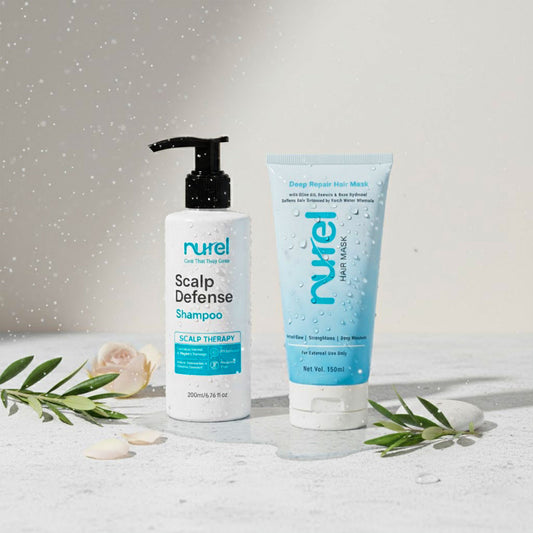 Nurel Scalp Defense Shampoo and Deep Repair Hair Mask on a light surface with decorative elements.