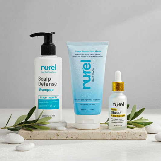Nurel hair care products including shampoo, hair mask, and gloss on a gray background with green leaves.